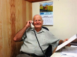 In the office keeping vendors and buyers up to date.