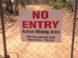 The locked gate preventing access to Flat Creek Road.