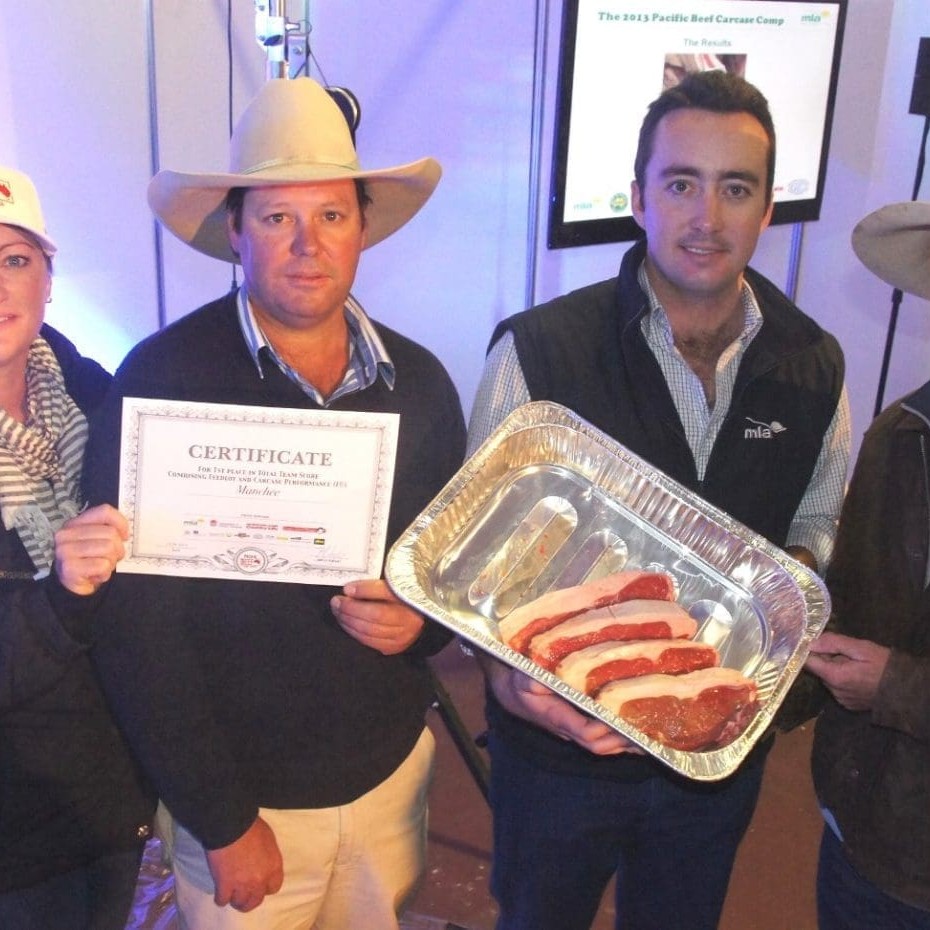 John and Liz Manchee, Yamburgan Shorthorns, left, congratulated by MSA's Jake Phillips and Maydan feedlot's Chris Rickert