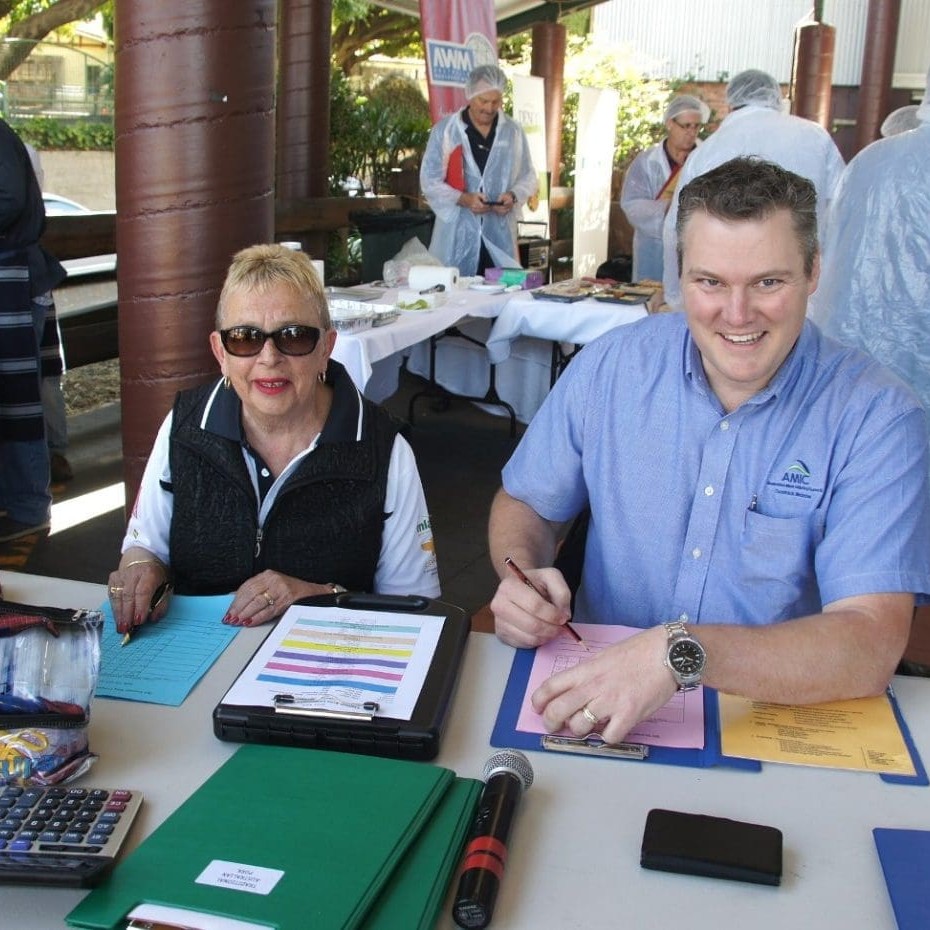 AMIC Qld state retail council chair Dom Melrose and AMIC's Gail Butler tallying results after one of the Sausage Kings state final classes