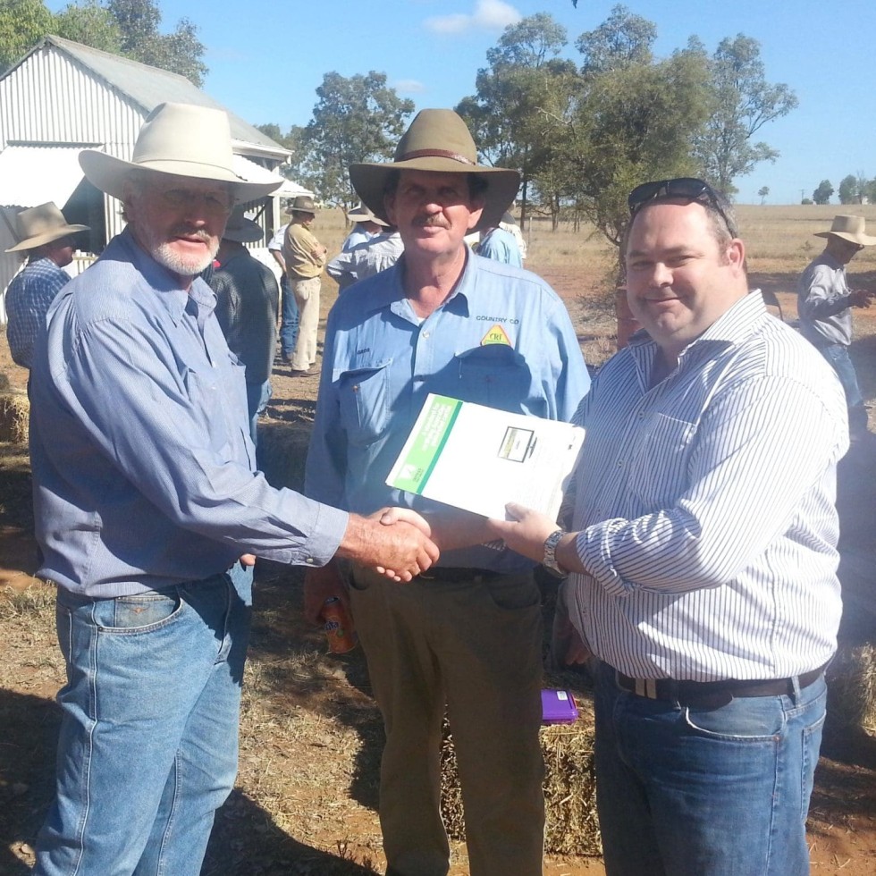 Rolleston's Ross Rolfe, left, receives his PCAS certification number one from CCA's Jed Matz and agent, Greg Hardgrave.