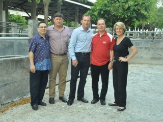 Sanko (left) and PJ (second from right) Hasan with John Cobb, Tony Abbott and Julie Bishop standing in empty pens in one of TUM's feedlots. 