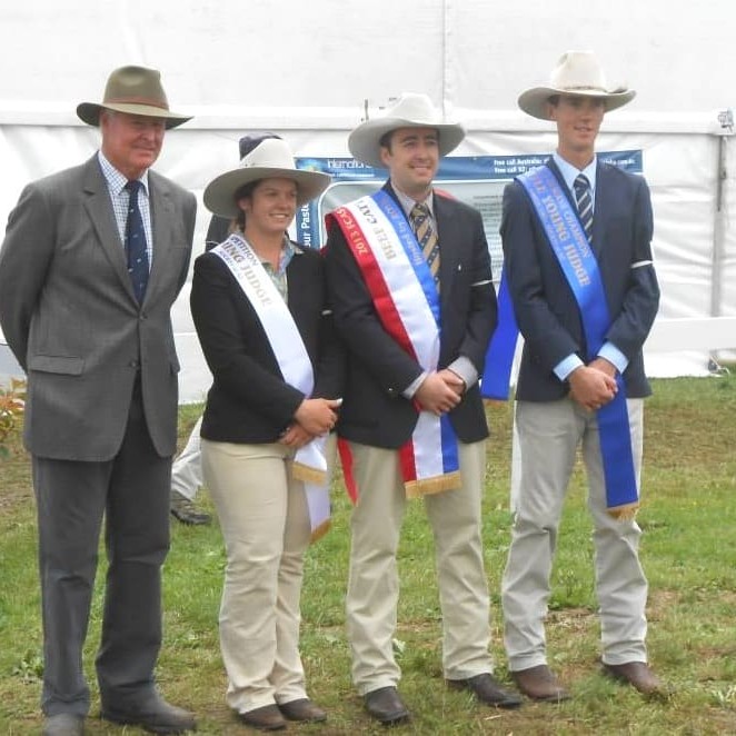 Australasian champion Young Judge, Jake Phillips, flanked by runner-up, Brandon Sykes and third placed Alice Hall, are congratulated by over-judge, respected NZ cattleman Russell Rowe.