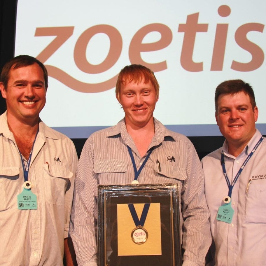 Zoetist medalist Ben Attewell, from Aronui feedlot, is congratulated by Zoetis's Scott Pavey, right, and Aronui manager David Bailey  