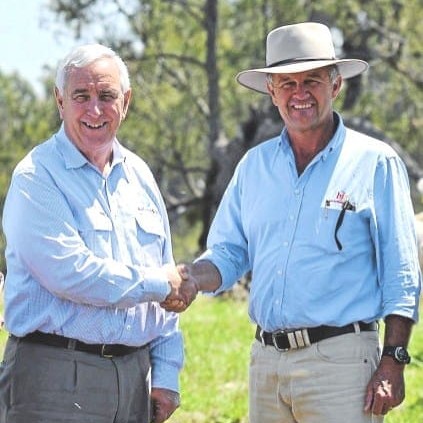 BJA's Bob Jamieson, right receives congratulations from Auctions-Plus chief executive Gary Dick for topping cattle turnover for the second consecutive year in 2012