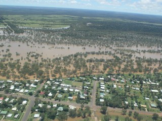 A temporary levy holds back floodwaters at Charleville. Picture: Pete Wade, South West Air Services, Charleville