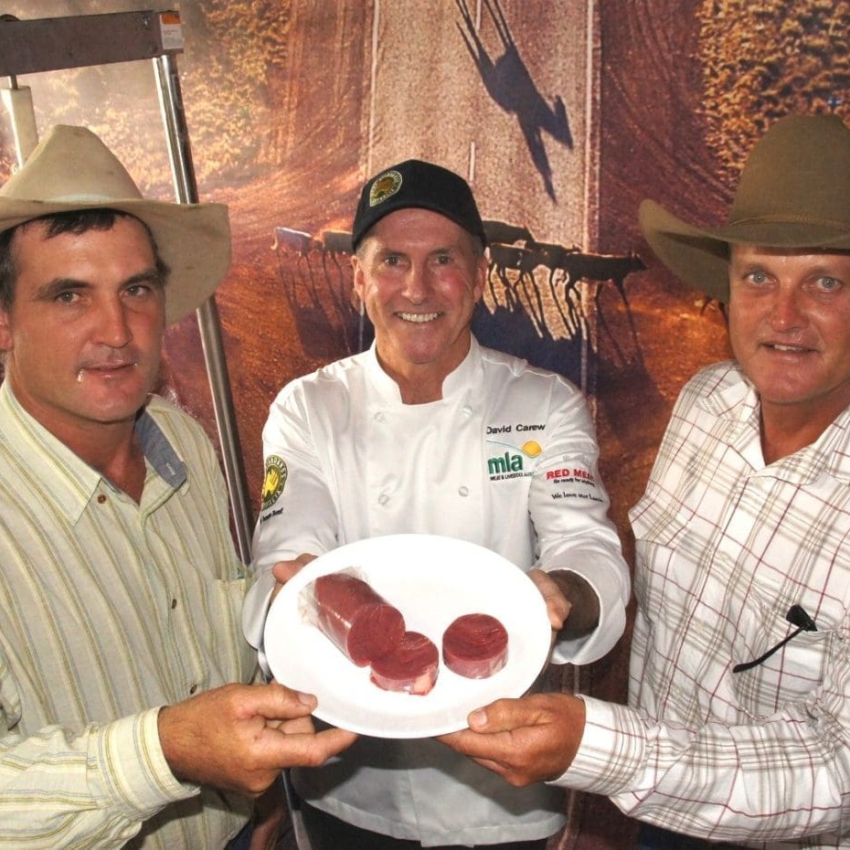 MLA's David Carew displays a sample of SmartShaped rump muscle to Beef 2012 visitors, Brett Blennerhasset, Bingil Bay, via Tully and Michael Norton, Burnside, Ingham,   