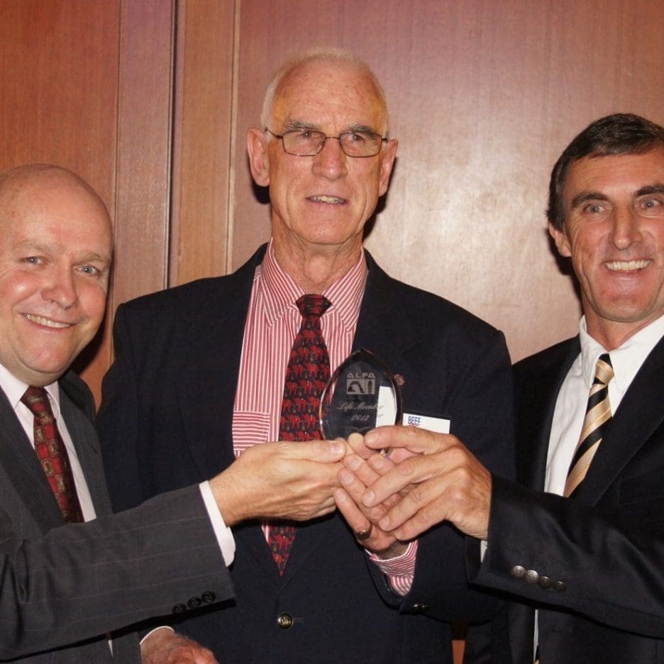 Rob Backus receives his ALFA Life Membership from president, Jim Cudmore, right, and Beef Central publisher Jon Condon