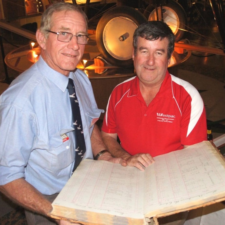 Fifth generation descendent of the first Bank of New South Wales Longreach account holder, Angus Deane, Malboona, and Westpac Queensland Agribusiness manager Rod Kelly with a copy of the branch's first customer ledger.