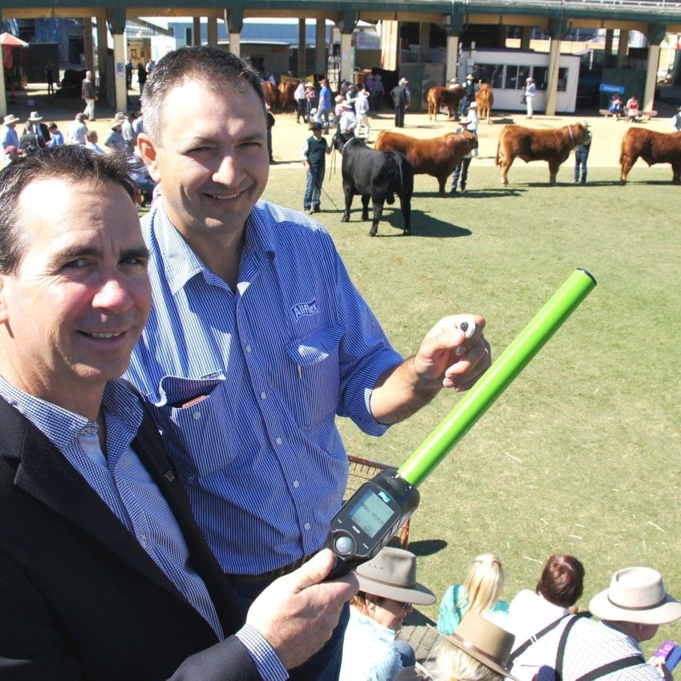 Allflex's Andrew Doljanin points out the features of the new wand to beef producer Cameron Daly, Arrabury Pastoral Co, at the Ekka beef judging this morning.