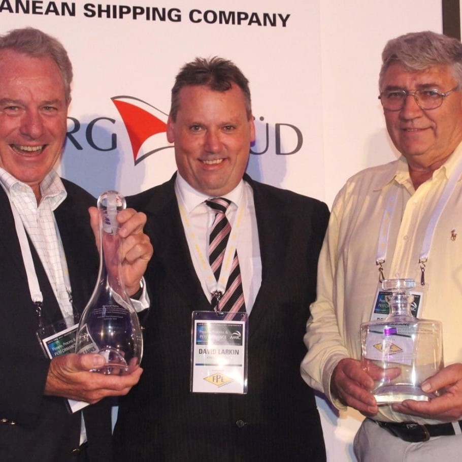 Richard Rains, left, and Ross Keane, right, accepting on behalf of Peter White, with AMIC chairman David larkin during the Special Recognition awards