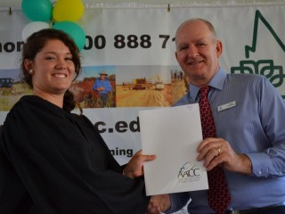 Emerald Agricultural College director Tony Robinson (right) congratulates the EAC's 2014 dux Jemma Joli at an award ceremony last Friday. 