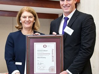Bundaberg butcher Geordan Bauer receives his scholarship from Queensland Governor, Penny Wensley