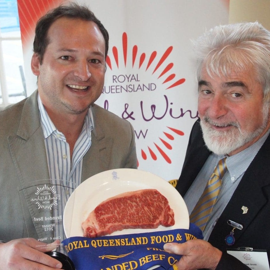 Jeremy Stuart from Andrews Meats, left, and chief judge Russell Smith, with Brisbane's grand champion branded beef, Tajima Fullblood.  More pictures and captions at bottom of page.