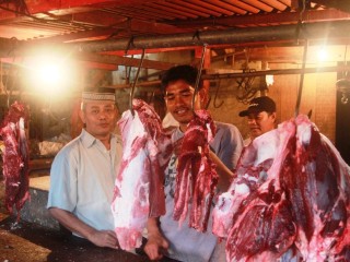 Haj Sulaiman (left), one of the largest meat traders in the Pasar Rau wet market at Seramat near Jakarta. 