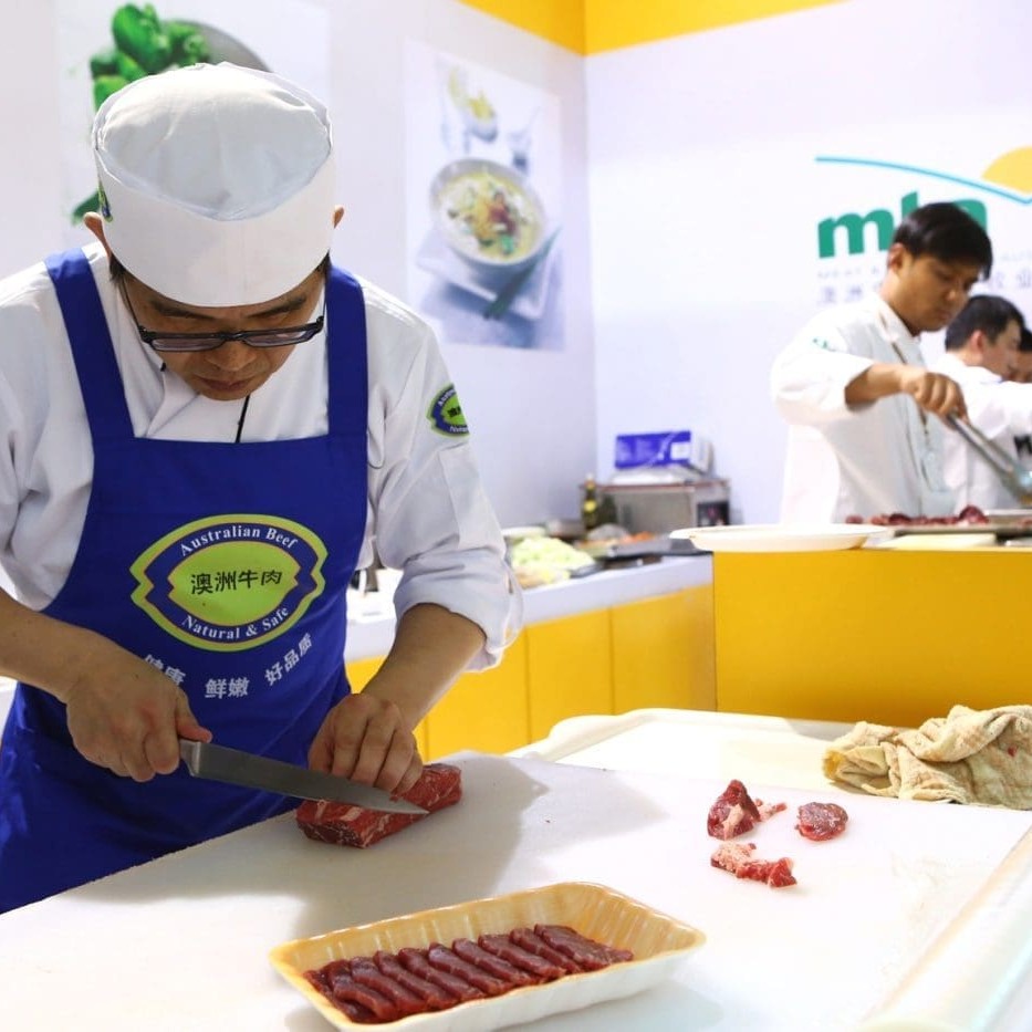 Portion-cutter Jerry prepares a fresh batch of displays for chilled cabinets in Australia's SIAL trade show exhibit  