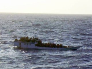 A picture taken by a crew member of the MV BIson Express of an overcrowded vessel before it sank north of Christmas Island on Wednesday. 