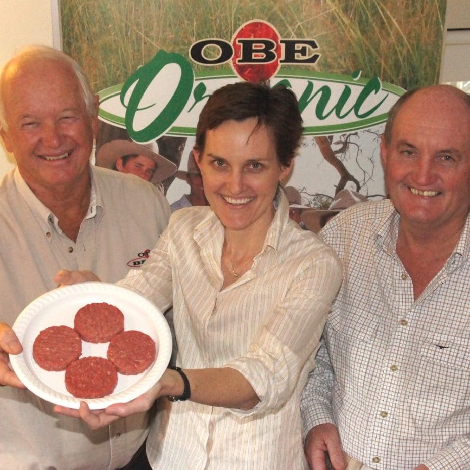 OBE directors Peter Schmidt, left, and David Brook, with Asia region manager Dalene Wray, holding a beef pattie production sample during Friday's Brisbane board meeting.