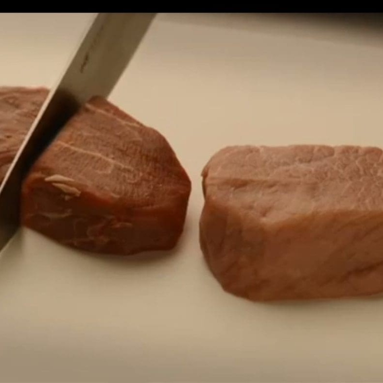 Still image from APL's TV ad claiming pork contains half the fat of red meat
