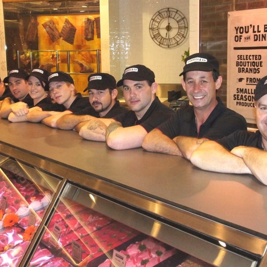 Principal, Peter Cabassi, right, with staff during this morning's store opening