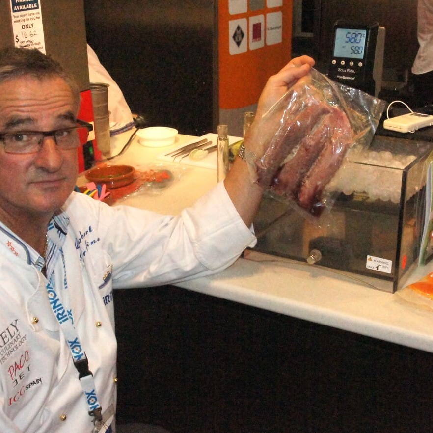 Rely's Robert Erskine with a sample of vac-sealed meat undergoing sous vide cooking. The unit shown at the Fine Food Show was transparent, for trade display purposes - commercial ones are stainless steel.