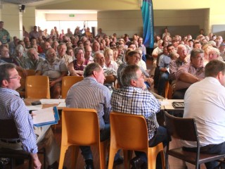 Ministers John McVeigh and Barnaby Joyce and farmers Rowell Walton and Peter Mailler in foreground listen to an address at the St George crisis forum on Saturday.