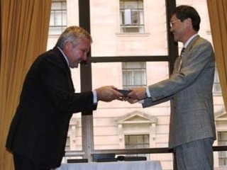 Terry Nolan, director of Nolan Meats, Gympie, receives the QJCCI Emerging Exporter Award from Junzo Fujita, Japan's Consul-General