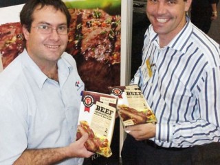 Teys Food Service sales and makreting team-member Simon Dwyer with a customer at the recent Fine Foods Queensland Expo