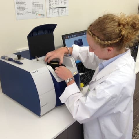 Feed Central's Sara Croft loads feed samples into the NIRS machine for testing 