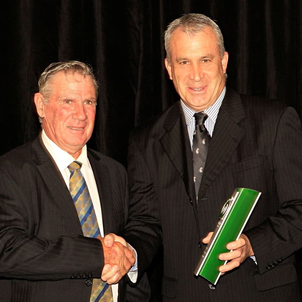 Woolworths national livestock manager Brett Thompson congratulates Ken Rigney after he received the 2011 Livestock Supplier award