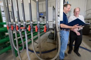 Former MSU Ph.D. student Jim Wallace (l) and faculty member Steve Safferman are part of a team that has developed technology designed to turn manure into useable water. The system also can extract nutrients from the manure that can be used safely as fertiliser. 