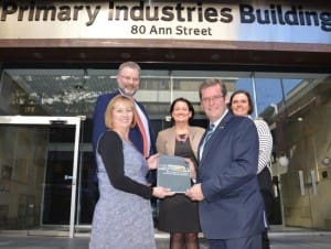 Jane McCauley from Kidman & Co and agriculture minister John McVeigh hold a copy of the handbook, with Terry Omond from Kidman & Co, Erin Gilliland from NAPCo and Cath Grahm from AA Co. 