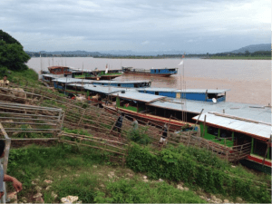 Laotian River boats loading at Chiang Saen, approximately 60 head/ boat.