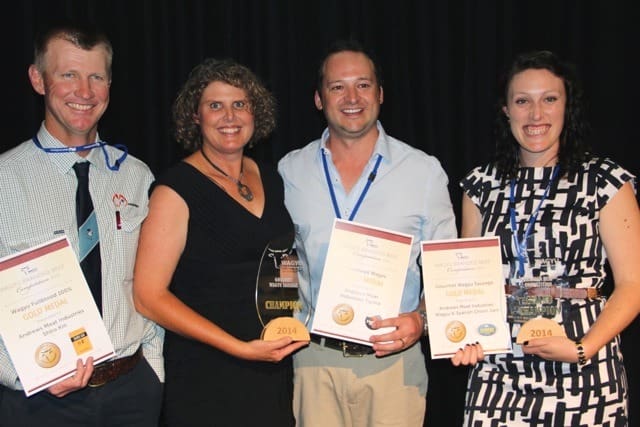 Winners are grinners: Fullblood class winner and overall grand champion Andrews Meat Industries is represented by export manager Jeremy Stuart and Kylie Schuller, right, while crossbred class winner Macquarie Downs is represented by Anthony and Chantal Winter.