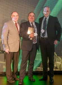 Smithfield Beef Co's Jason Sheaer-Smith accepts Woolowrths Livestock Supplier of the Year award from general manager, supermarkets, Pat McEntee and national beef procurement manager Brett Thompson.