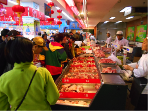 The very busy pork counter at a Shanghai supermarket.