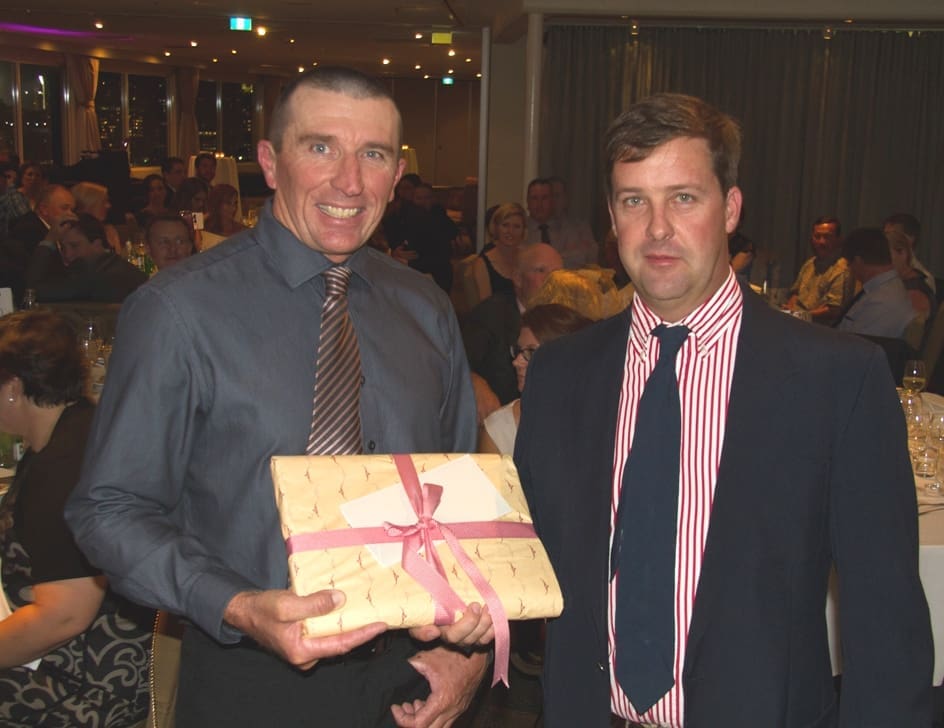 Team-work award winner mark Walsh, manager of Mimong Station, near Kynuna, receives his award from CPC general manager Queensland, Alex Walsh.
