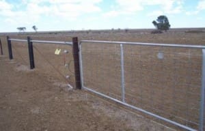 The electric fence design is six plain wires with a barb on top.