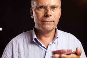 Dr Mark Post with his cultured beef patty in 2013. Image: Cultured Beef