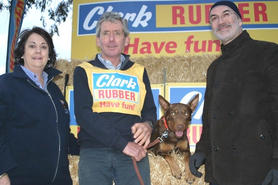 Casterton Kelpie Association president Karen Stephens, left, with Ian O'Connell, breeder of the $11,000 top-priced Kelpie Bagalla Bart, and Clark Rubber CEO Chris Malcolm.