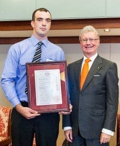Byron Allsop receives his scholarship from Qld governor, Paul de Jersey