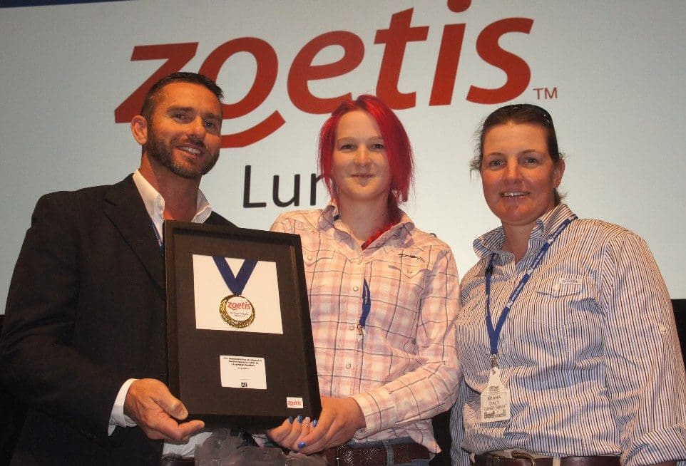 Lorelle Starr is congraulted after receiving the 2015 Zoetis Education Medal at BeefWorks by Zoetis's Andrew Malloy and Ladysmith manager Brianna Daly