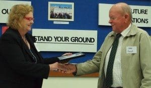 Former PRA president Joanne Rea awards John Purcell with life membership in 2012.