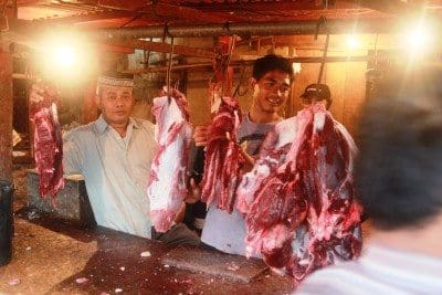 Butchers in a West Java wet market.