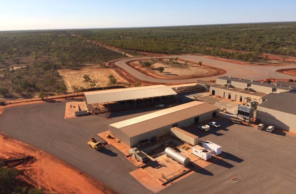 Aerial view with triple roadtrain unloading loop at rear, and cleared area for holding yards to its left. 