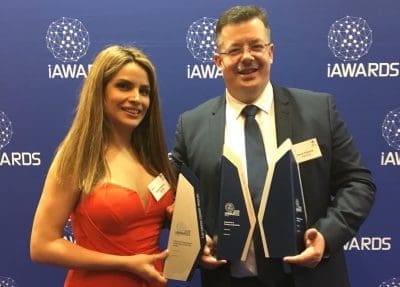 Automed principal David Edwards collects his company's awards at the recent iAwards in Canberra.