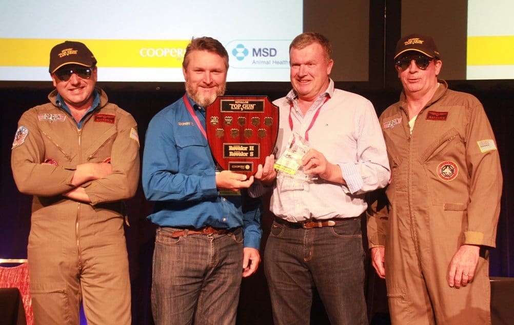 Andrew Herbert accepts the 2016 Coopers Top Gun award on behalf of Gundamain feedlot's induction team from Coopers' Rob Baynes, flanked by the Coopers "Top Guns" 