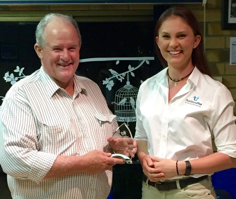 AuctionsPlus marketing officer, Alexa Hearn presents Tom Brodie with his 2015-16 Top Cattle Assessor award last week.