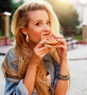 Girl eating a burger