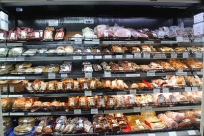 Packaged and processed meats on display in the deli section at Mondo Butchery